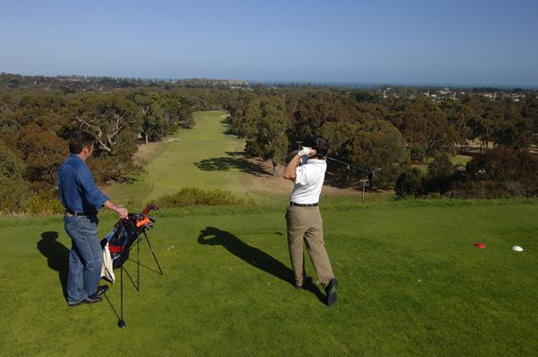 Playing Golf at Victor Harbour Golf Course: a great place to visit in Victor Harbor. Image &copy SATC; Adam Bruzzone. This photo sponsored by Security - Systems Category.